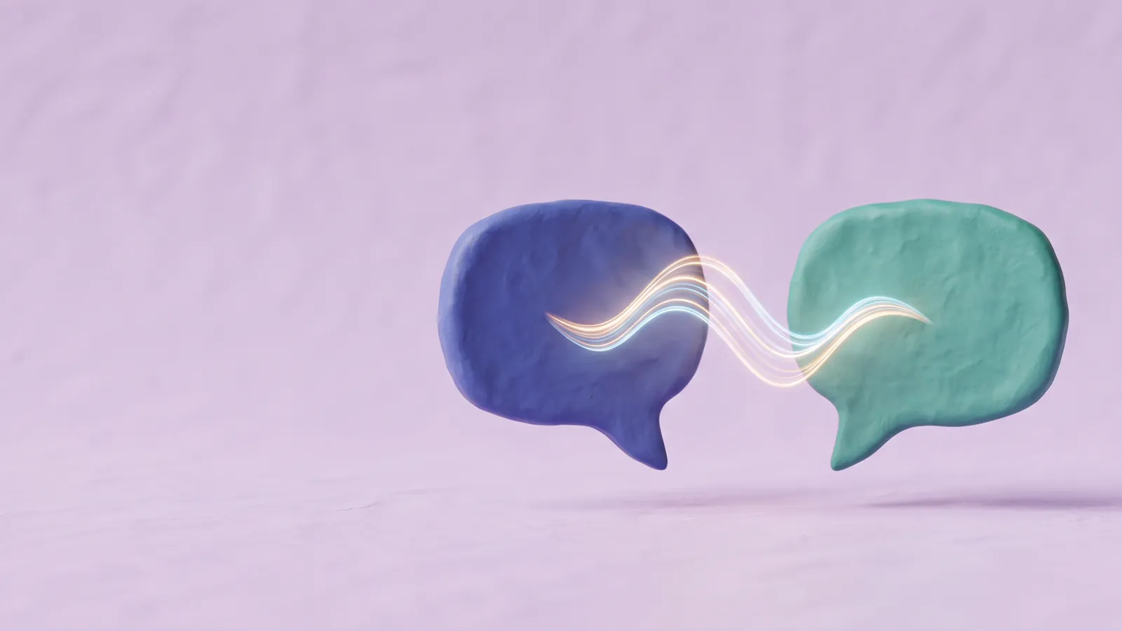 Two matte clay speech bubbles in indigo and teal with a glowing sound wave between them